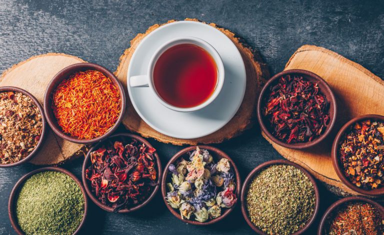 set-wood-stubs-cup-tea-tea-herbs-bowls-dark-textured-background-flat-lay.jpg